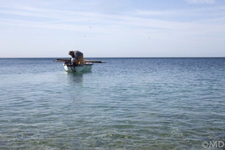 Local pot fisherman preparing boat at Chesil Cove, Dorset, UK Local pot fisherman preparing boat at Chesil Cove, Dorset, UK